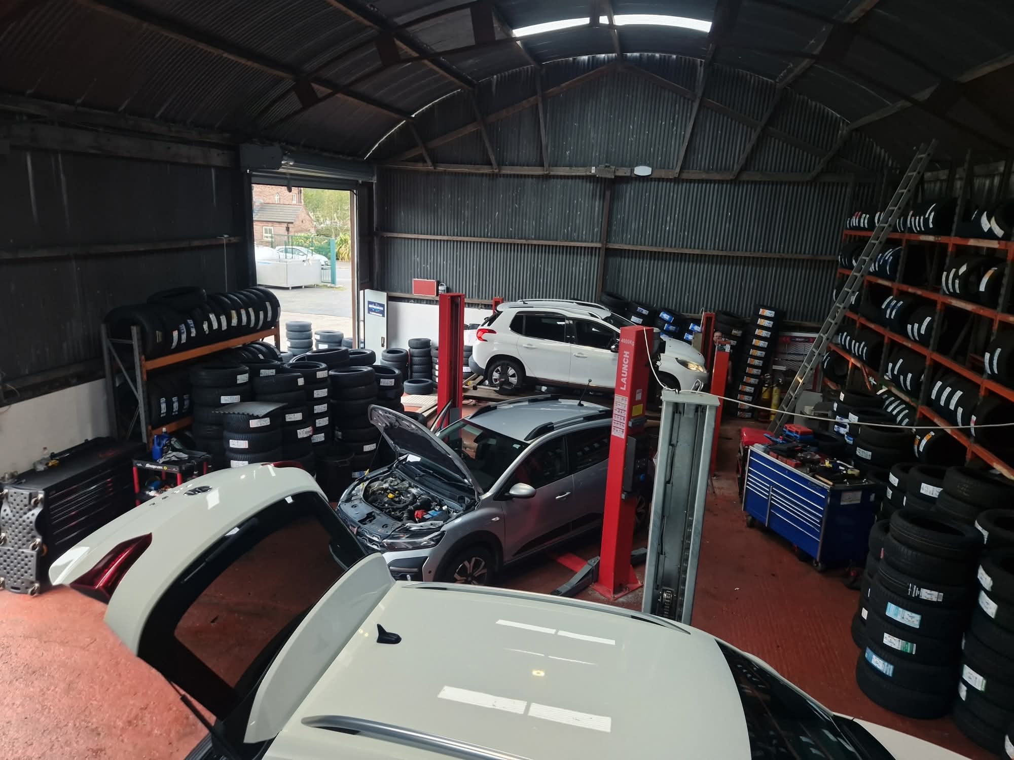 Workshop interior with cars on lifts