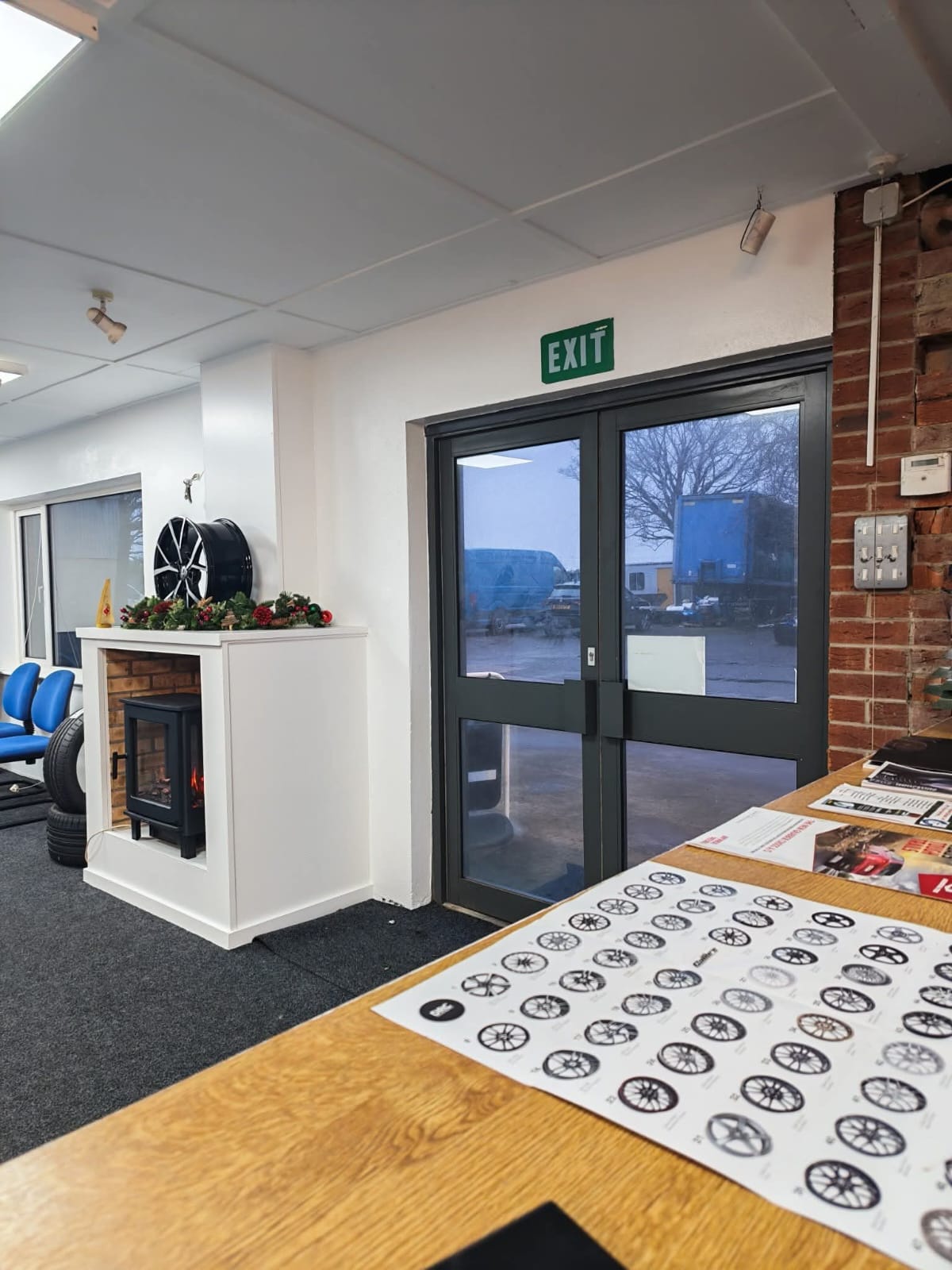 Comfortable customer waiting room with fireplace